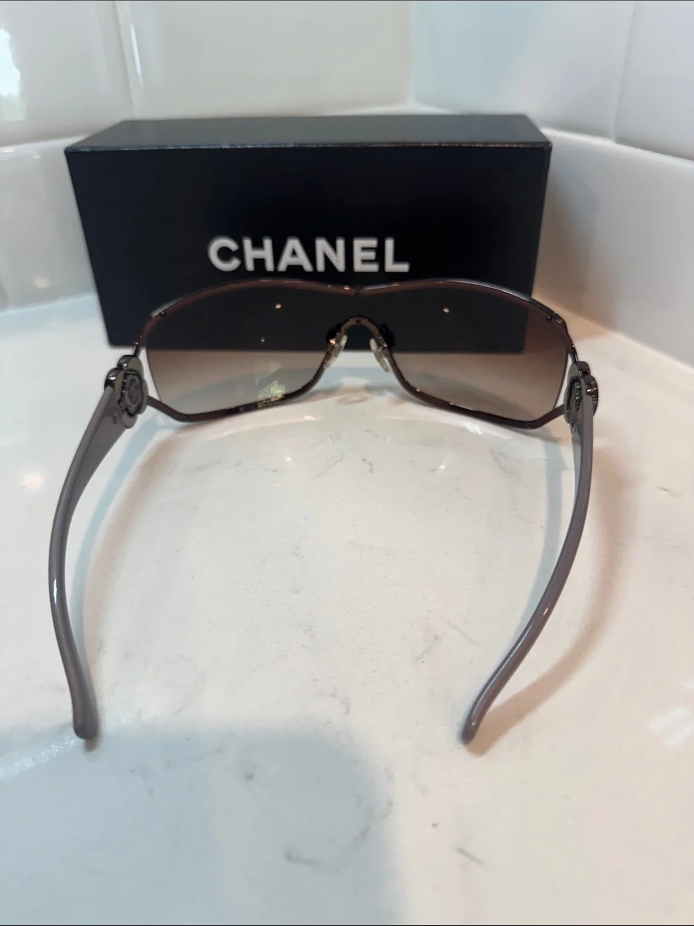 Chanel  Camellia flower with crystal-embellished interlocking CC logo